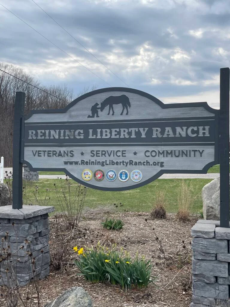 A Veteran connects with a horse at Reining Liberty Ranch